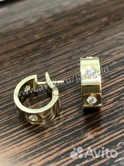 Золотые серьги Cartier